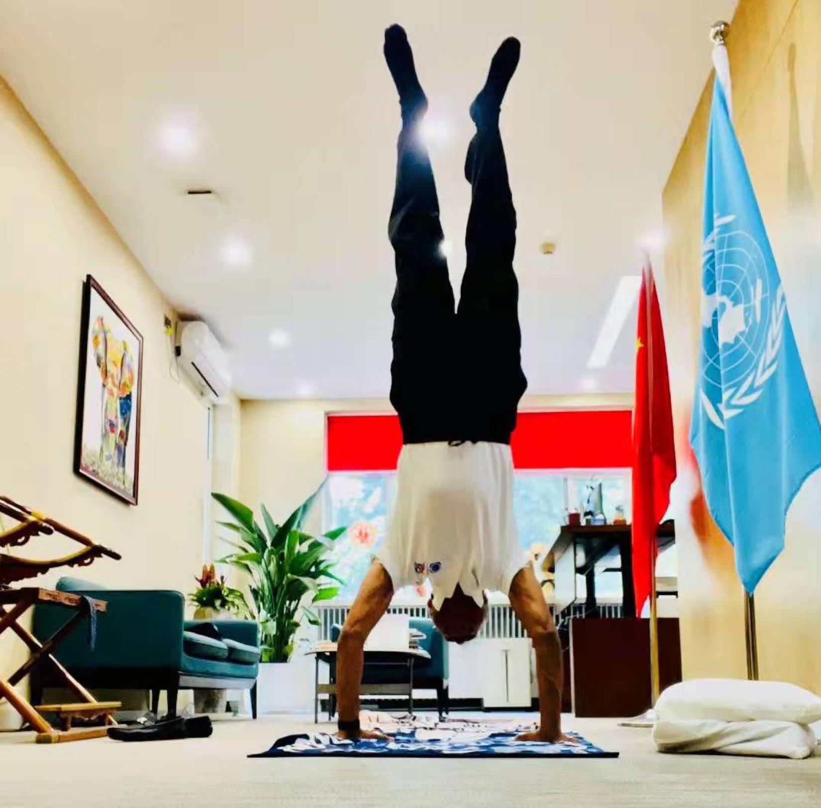 Caption- Siddharth Chatterjee (pictured) practising yoga in his office.