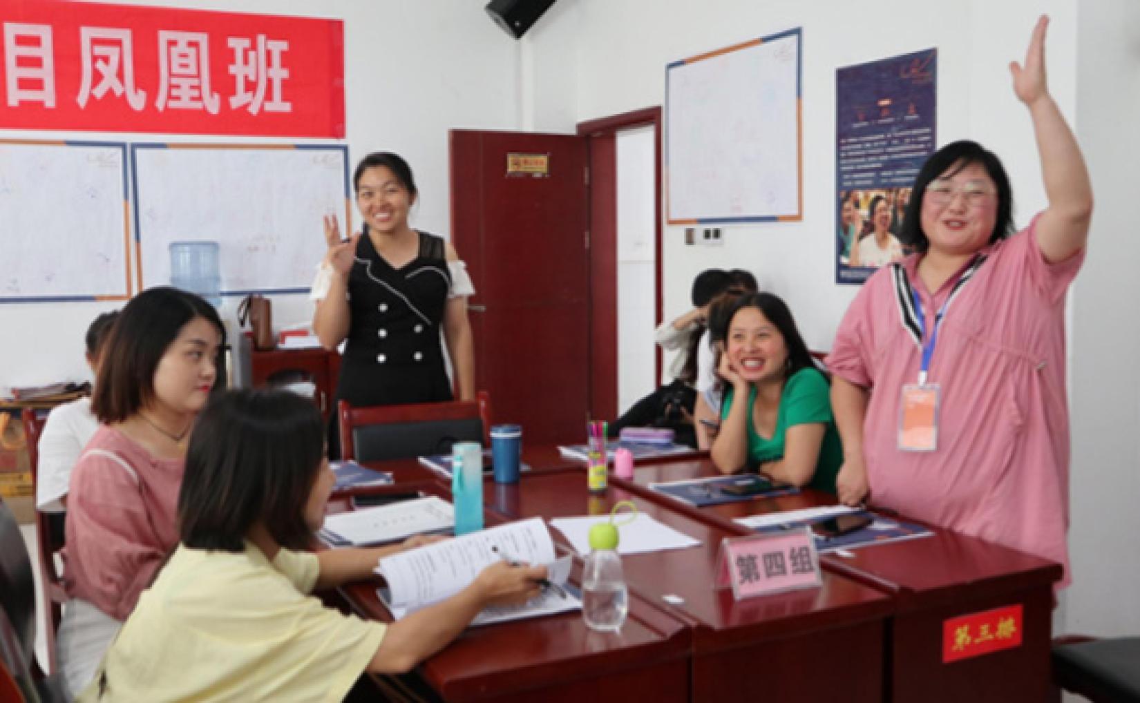 Ma Qinyan (right) speaks at a training session in Fenghuang as part of the Women Up initiative.