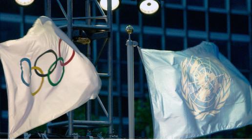 The United Nations and the Olympic flags raised at UN Headquarters. /UN Photo/Evan Schneider