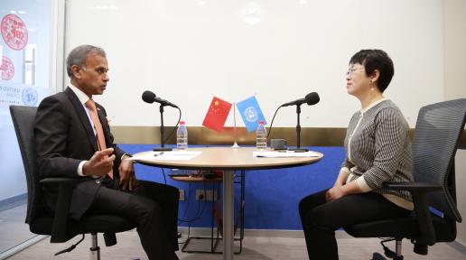 Caption: UN Resident Coordinator in China Siddharth Chatterjee sits down with Zhou Kai, the Acting Country Director in China for the Joint United Nations Programme on HIV/AIDS (UNAIDS)